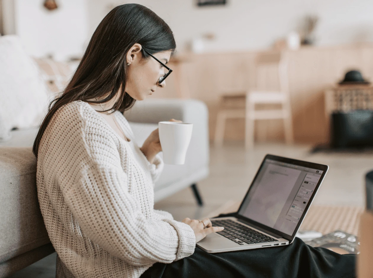 A creator working on her online business from a laptop at home